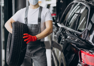 mechanic-changing-tires-car-service_1303-26902